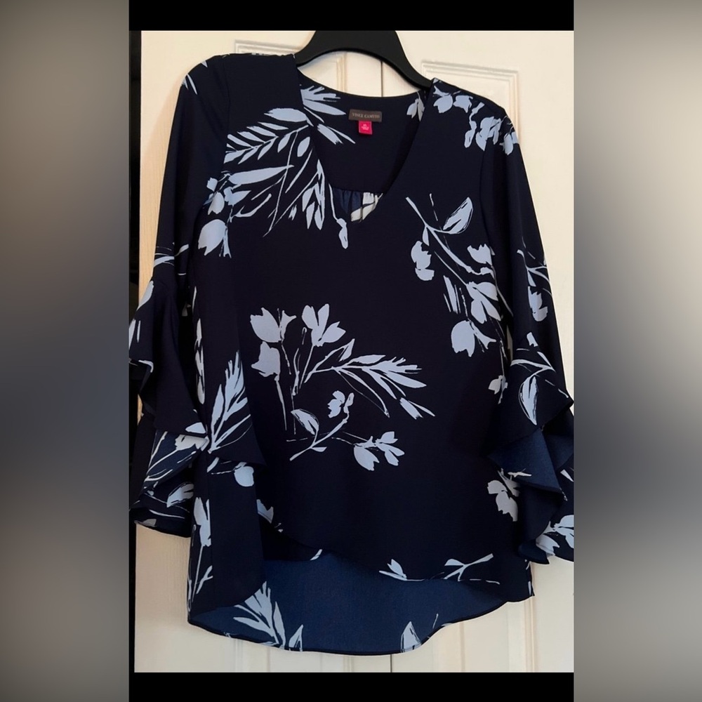 New blouse with tags.  3/4 flowy sleeves.